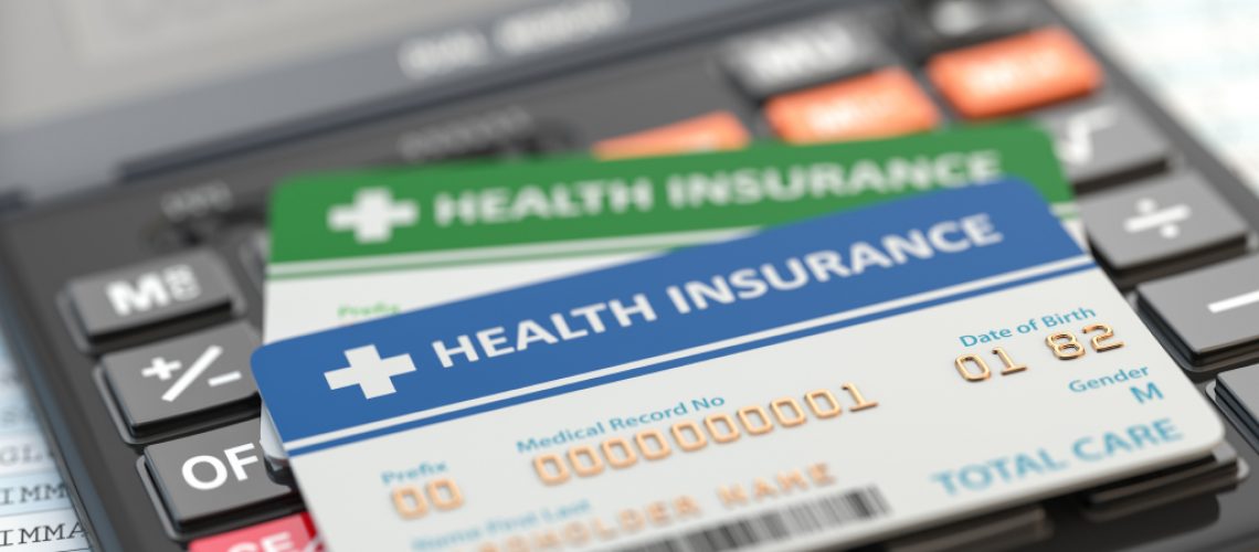 medical-insurance-cards-on-the-calculator-health-JCSolutions